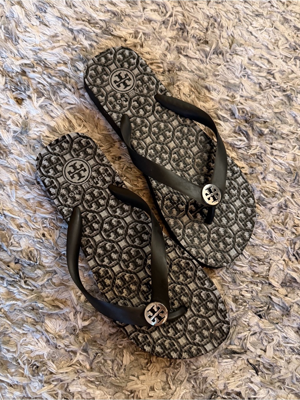 Tory Burch Black Logo-Pattern Flip Flops with Silver Medallion